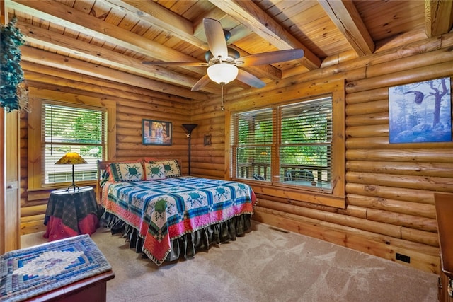 carpeted bedroom with ceiling fan, beam ceiling, log walls, and wooden ceiling