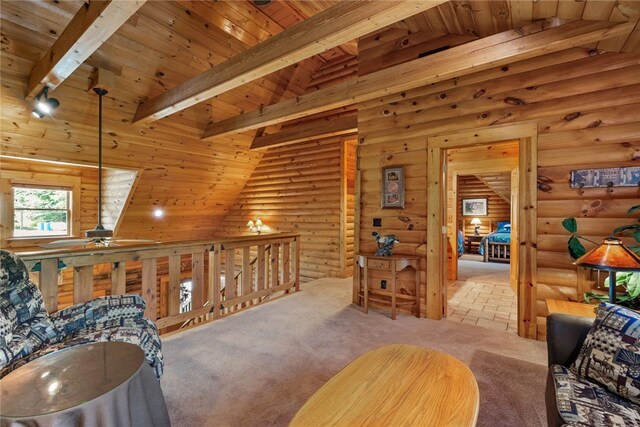 carpeted living room featuring wood ceiling and log walls