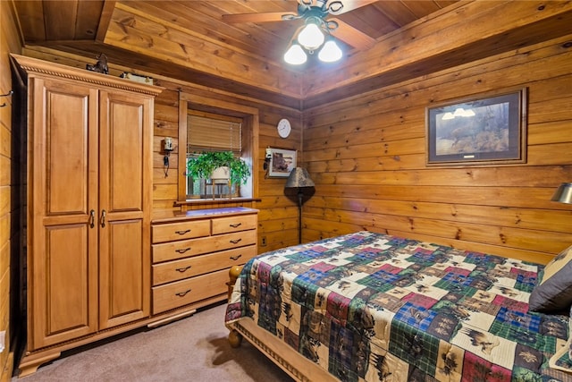 carpeted bedroom featuring ceiling fan and wood ceiling