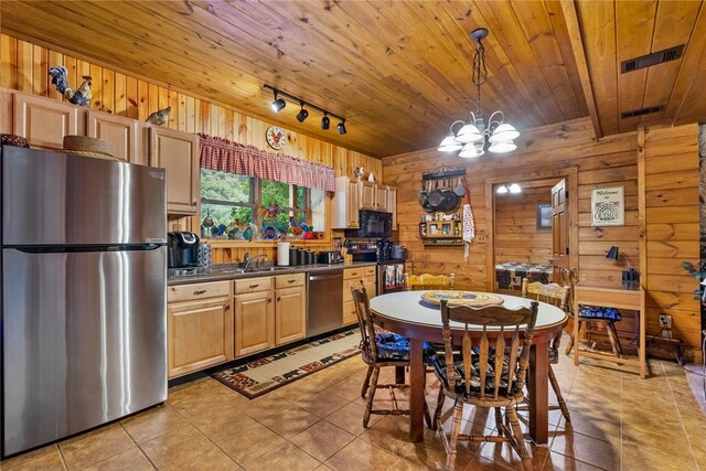 kitchen with appliances with stainless steel finishes, wooden ceiling, light tile patterned floors, and track lighting