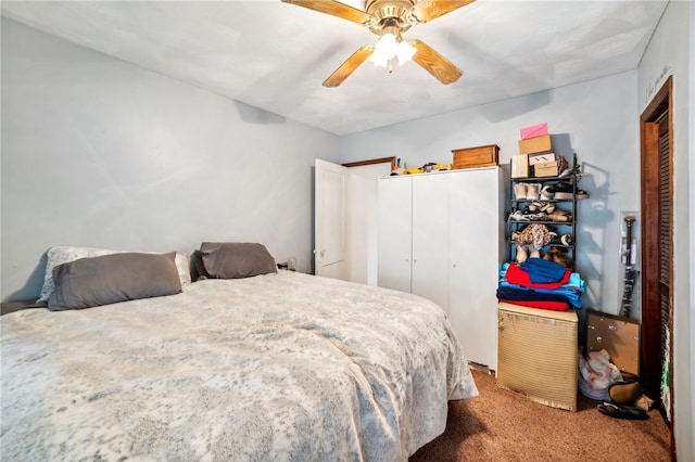 carpeted bedroom featuring a closet and ceiling fan