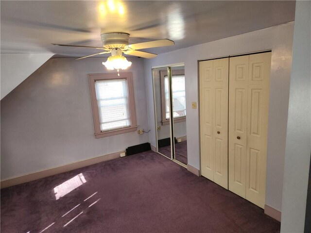 additional living space featuring ceiling fan, dark carpet, and vaulted ceiling