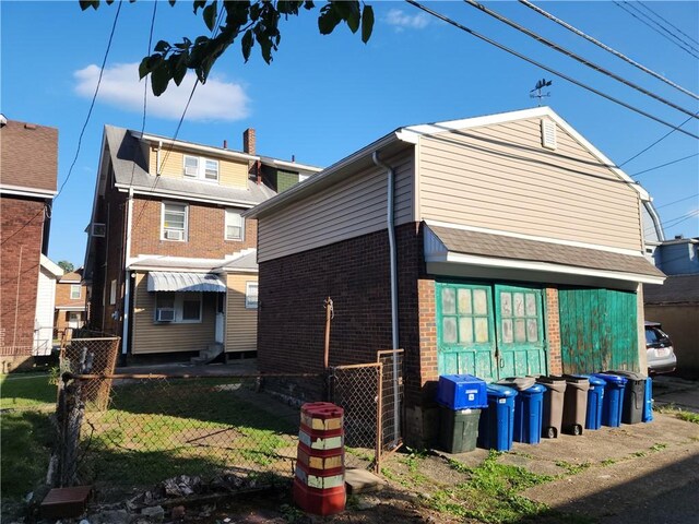 rear view of property with a lawn