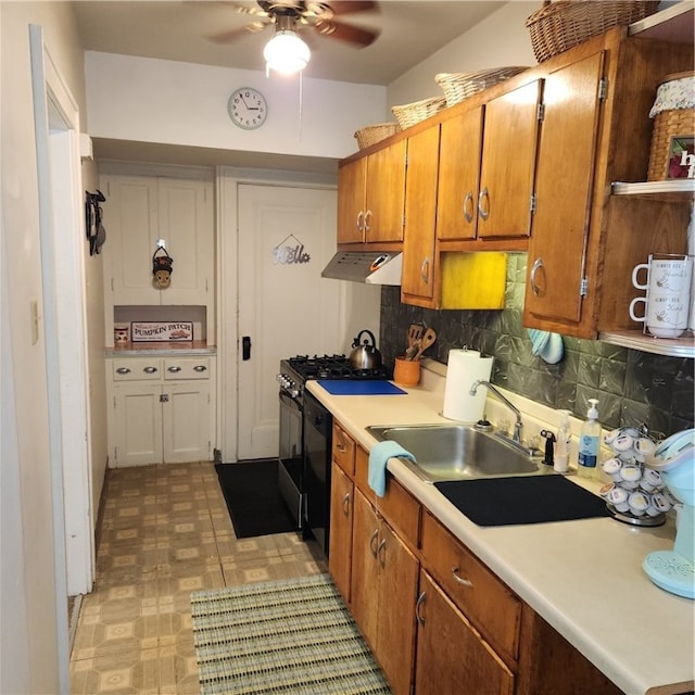 kitchen with black appliances, ceiling fan, sink, and backsplash