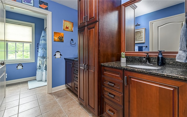 bathroom with tile patterned flooring and vanity