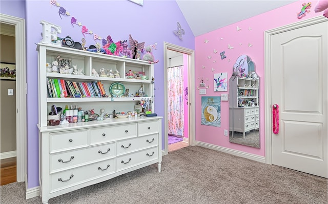 carpeted bedroom featuring vaulted ceiling