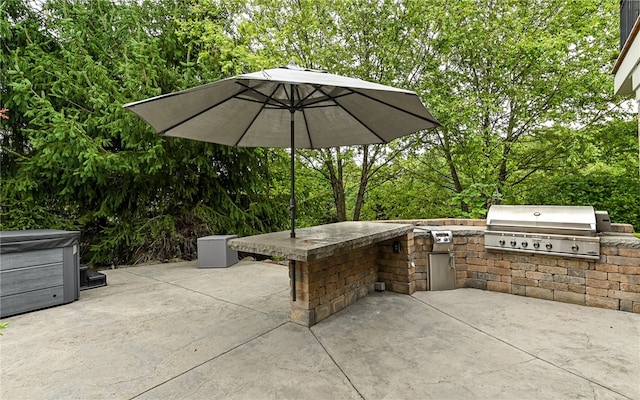 view of patio with a grill and exterior kitchen