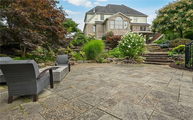 view of patio / terrace with a fire pit