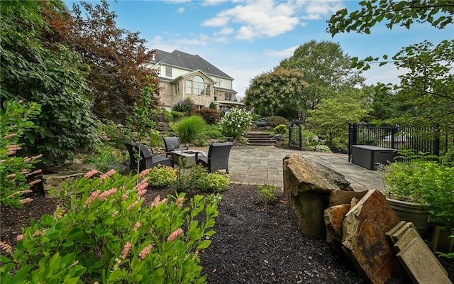 view of yard with outdoor lounge area and a patio