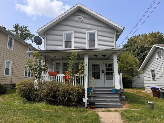 view of front of property featuring covered porch and a front lawn