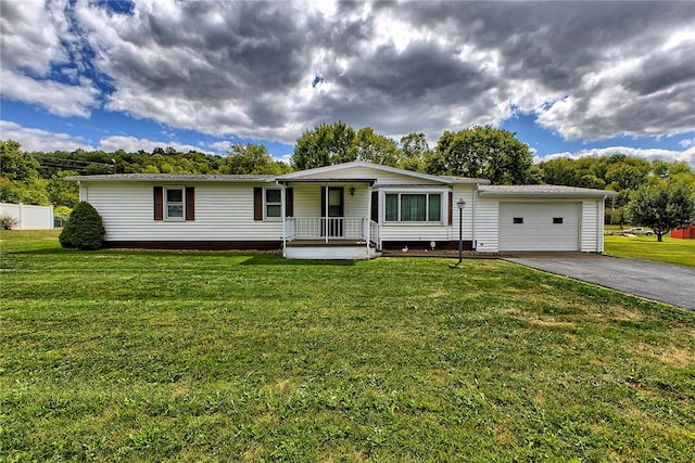 view of front of property featuring a garage, a porch, and a front yard