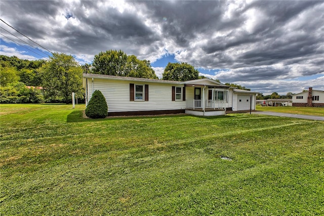 view of front of house with a garage and a front yard