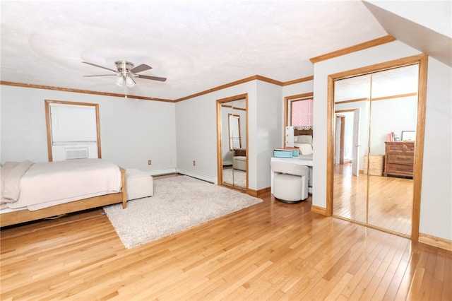 bedroom featuring ceiling fan, light hardwood / wood-style floors, and ornamental molding