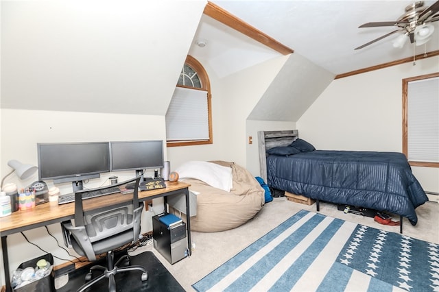 carpeted bedroom with ceiling fan and vaulted ceiling