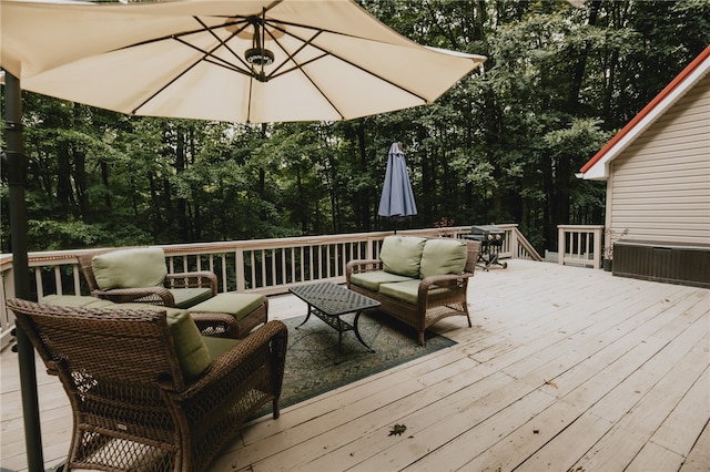 wooden terrace featuring an outdoor living space