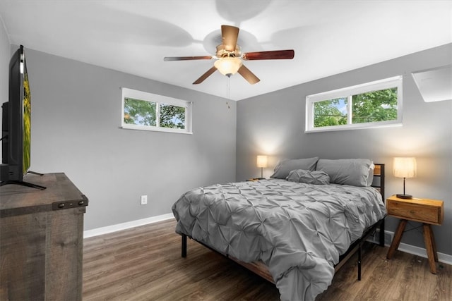 bedroom with ceiling fan and hardwood / wood-style flooring