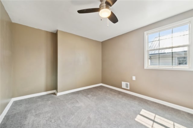 carpeted empty room with ceiling fan