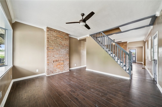 unfurnished room with hardwood / wood-style floors, brick wall, ceiling fan, and a textured ceiling