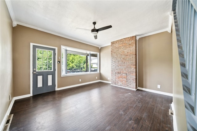 unfurnished room featuring a textured ceiling, dark wood-type flooring, and brick wall