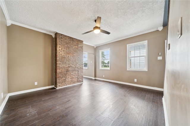 empty room with a textured ceiling, ceiling fan, crown molding, and hardwood / wood-style flooring