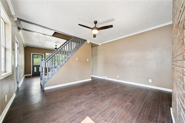 empty room featuring ceiling fan, wood-type flooring, and a textured ceiling