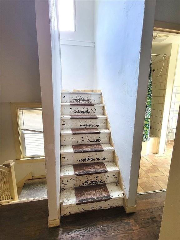 stairs with wood-type flooring