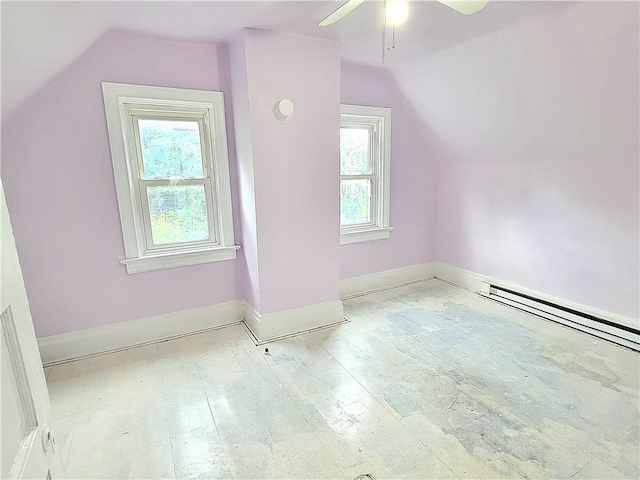 additional living space featuring ceiling fan, lofted ceiling, hardwood / wood-style floors, and baseboard heating