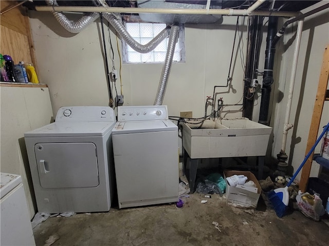 laundry area with sink and washer and clothes dryer