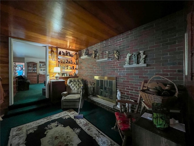 interior space featuring carpet floors, wooden ceiling, and brick wall