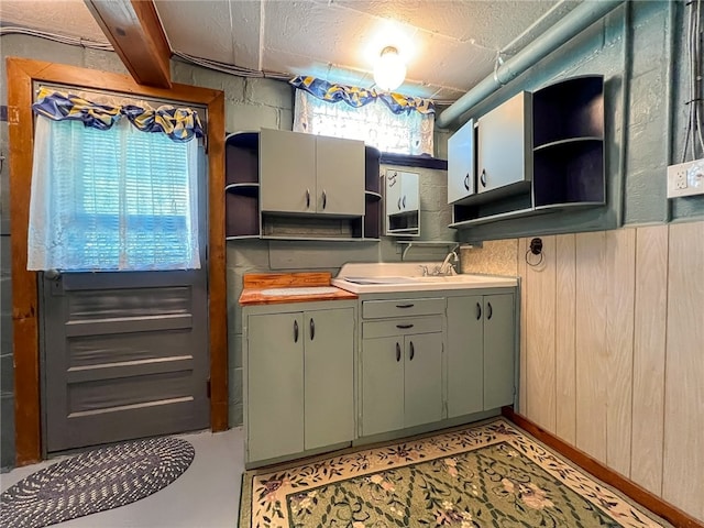 kitchen featuring sink and a textured ceiling