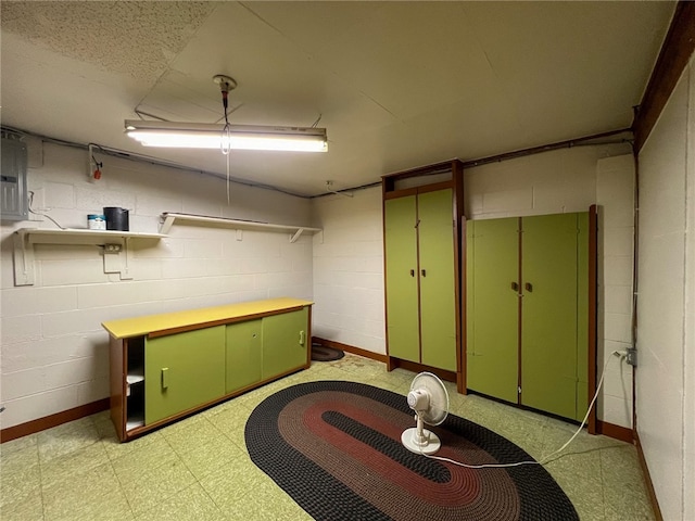 basement featuring light tile patterned floors