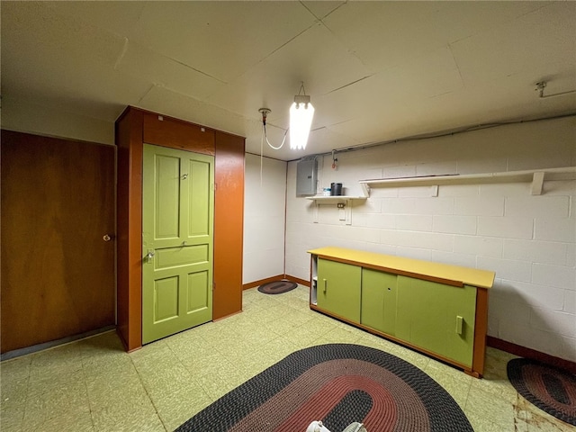 basement with electric panel and tile patterned floors