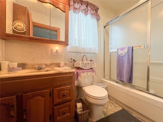 full bathroom with combined bath / shower with glass door, decorative backsplash, toilet, tile patterned flooring, and vanity