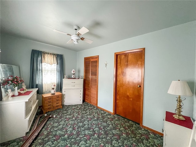 carpeted bedroom featuring ceiling fan