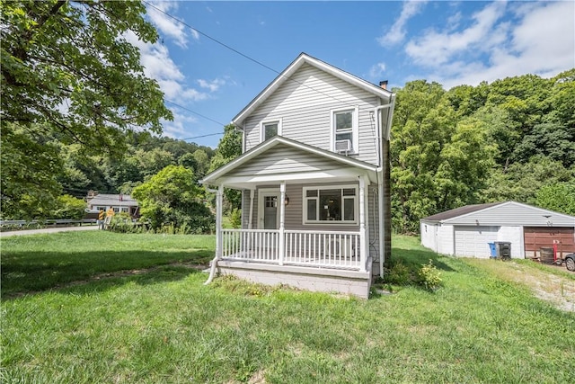 view of front of house featuring an outbuilding, covered porch, a garage, a front lawn, and a chimney