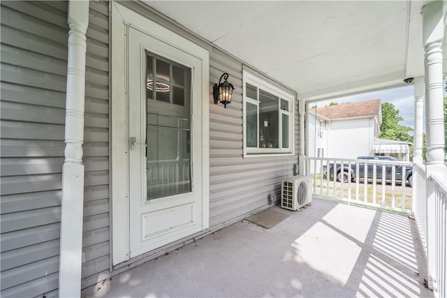 view of patio with covered porch and ac unit