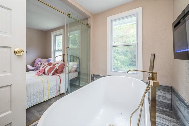 bedroom with hardwood / wood-style flooring