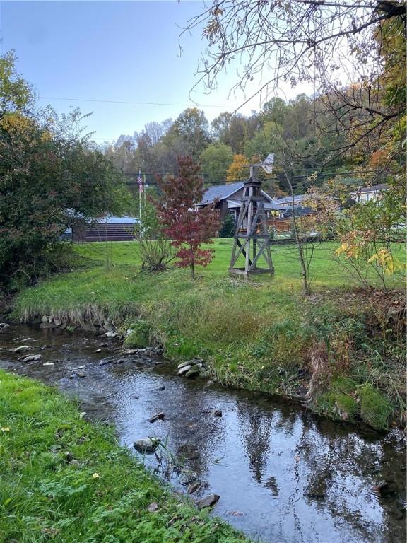 view of yard with a water view