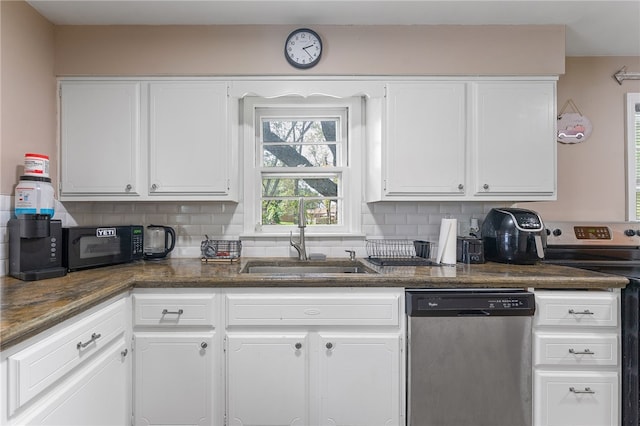 kitchen with range with electric cooktop, dishwasher, tasteful backsplash, sink, and white cabinetry