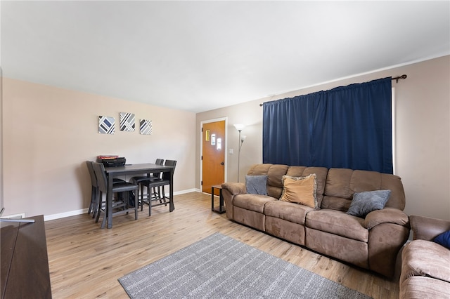 living room with light hardwood / wood-style floors