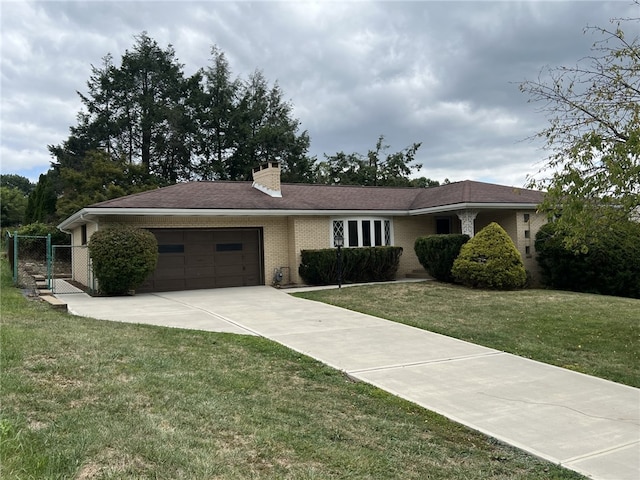 single story home featuring a front yard and a garage