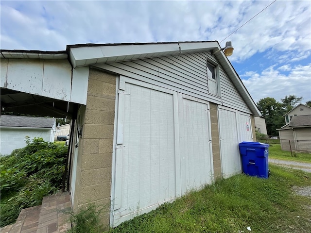 view of home's exterior featuring an outbuilding