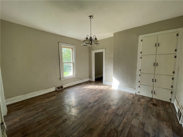 interior space with hardwood / wood-style flooring and a chandelier