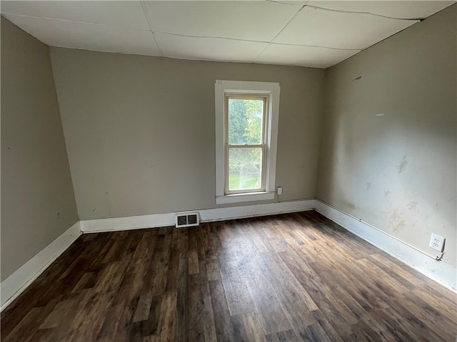 empty room with dark wood-type flooring