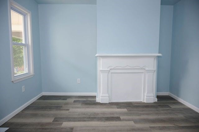 unfurnished living room with hardwood / wood-style floors