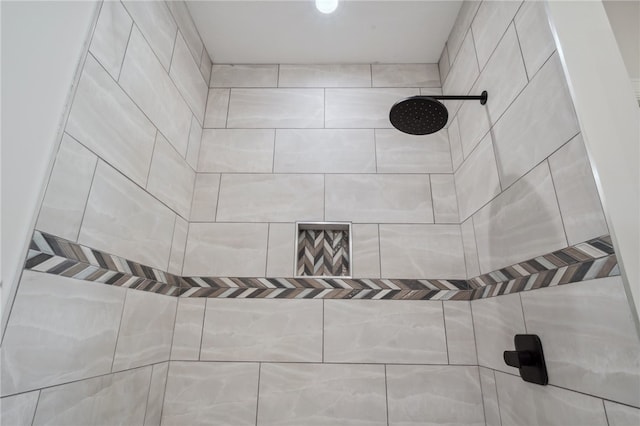 bathroom with tiled shower