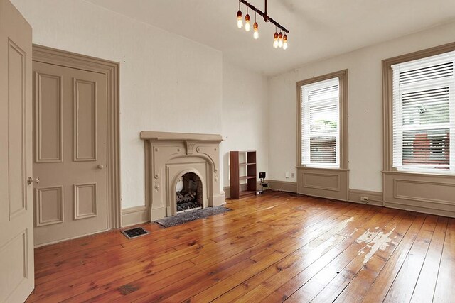 unfurnished living room with light hardwood / wood-style floors