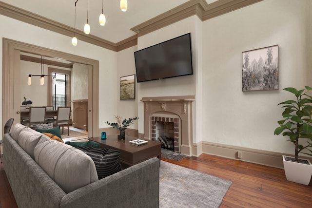 living room featuring dark wood-type flooring and ornamental molding