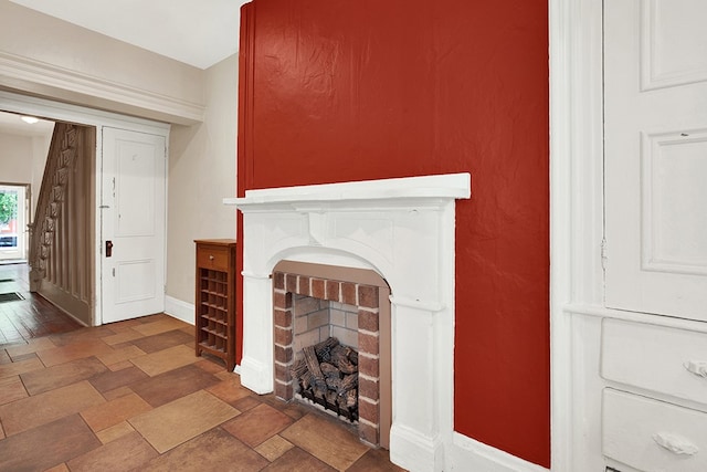 tiled living room featuring a fireplace