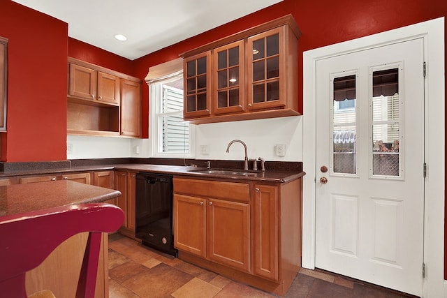 kitchen featuring black dishwasher, tile patterned flooring, and sink